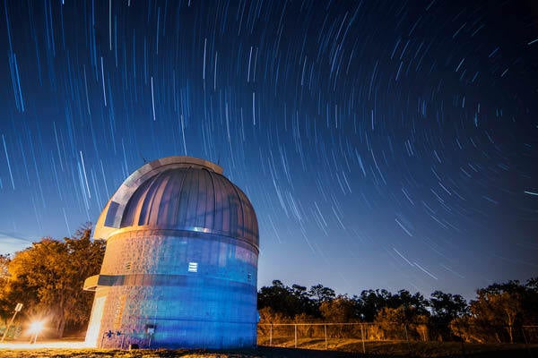Robinson Observatory at night surrounded by stars